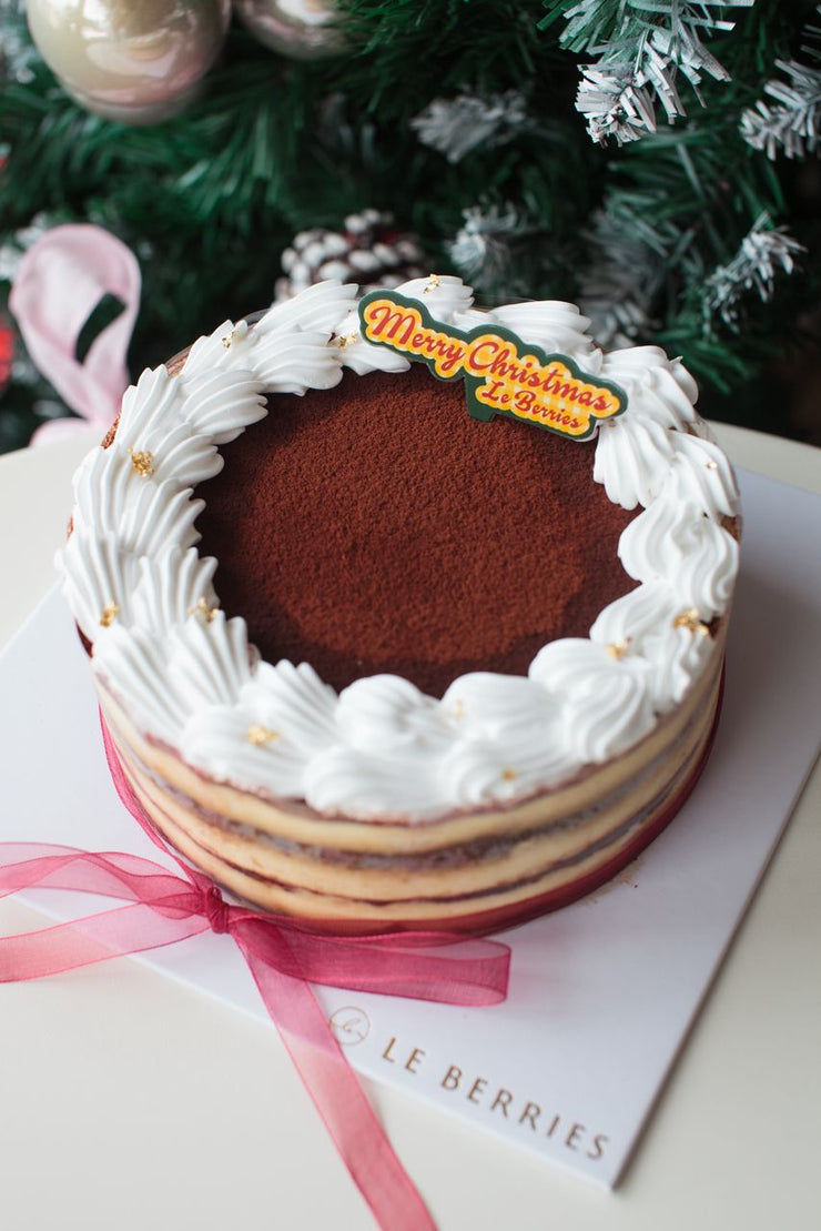 Tiramisu cake with white frosting and &